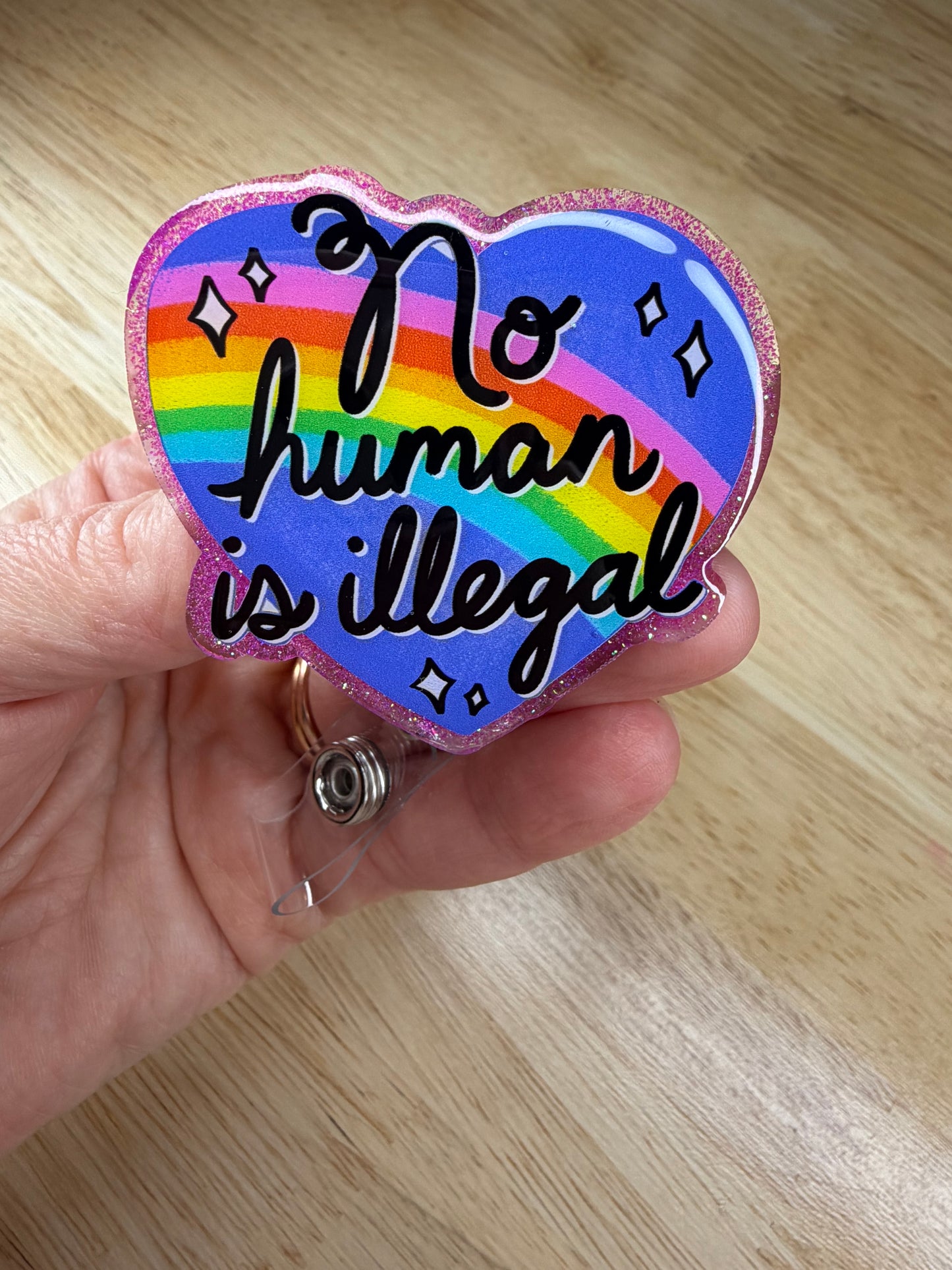No Human Is Illegal Badge Reel